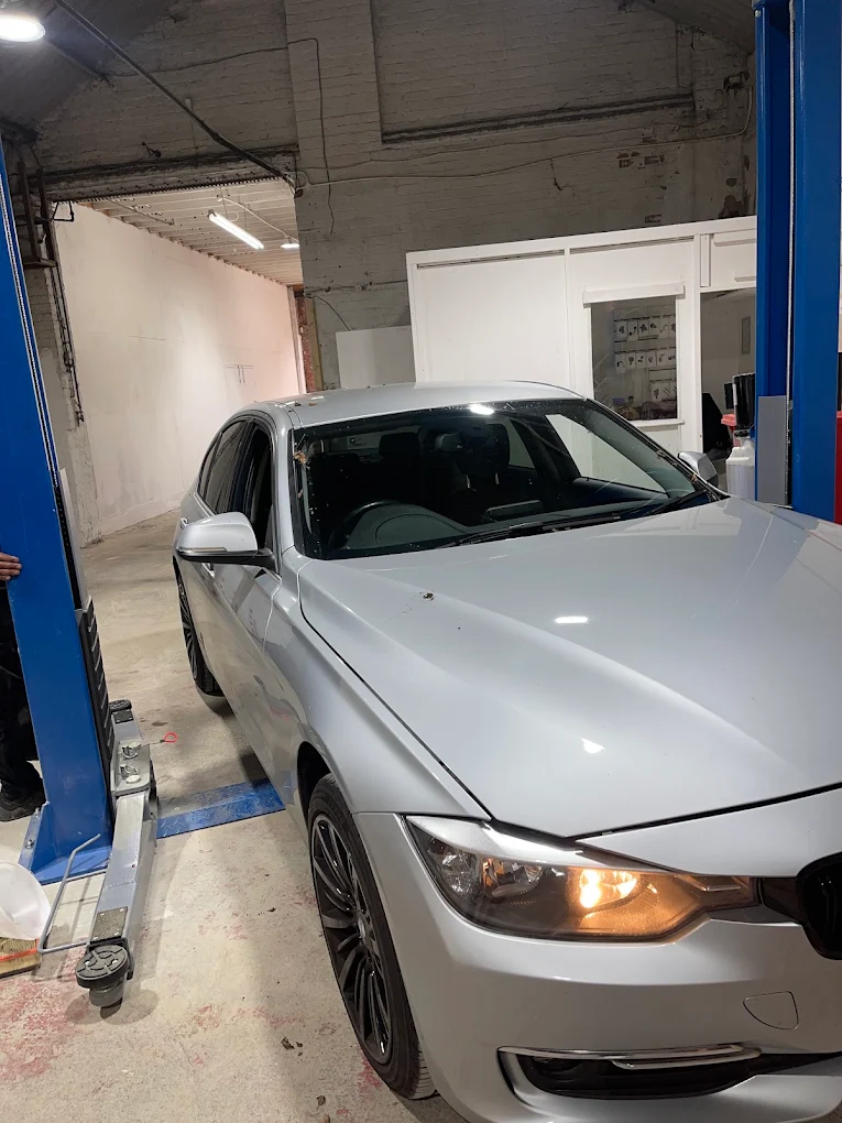 Car on the lift inside Safi Autos workshop